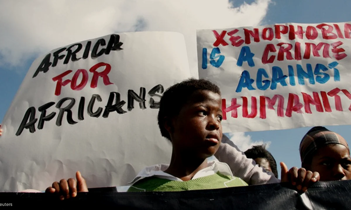 People moving across a landscape, illustrating migration and regional responsibility in Africa